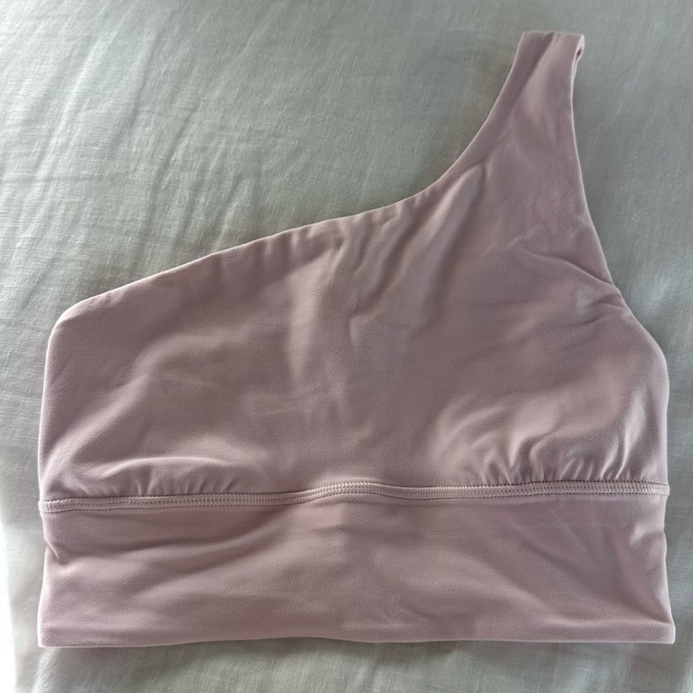 Lululemon feather pink one shoulder sports bra in perfect condition. Size 4